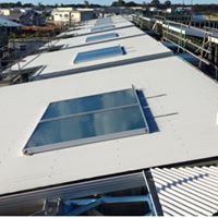 Rooftop solar hot water systems fitted to a large building in Maroochydore